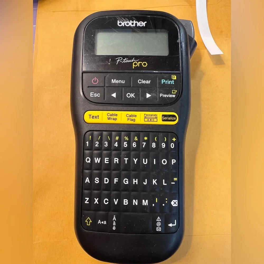 Brother P-touch Pro Label Maker in Black and Yellow, White Label tape included